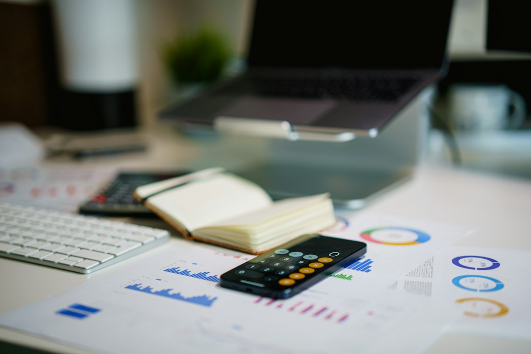 Financial report and cost calculations on a desk, illustrating Nigeria's public debt figures